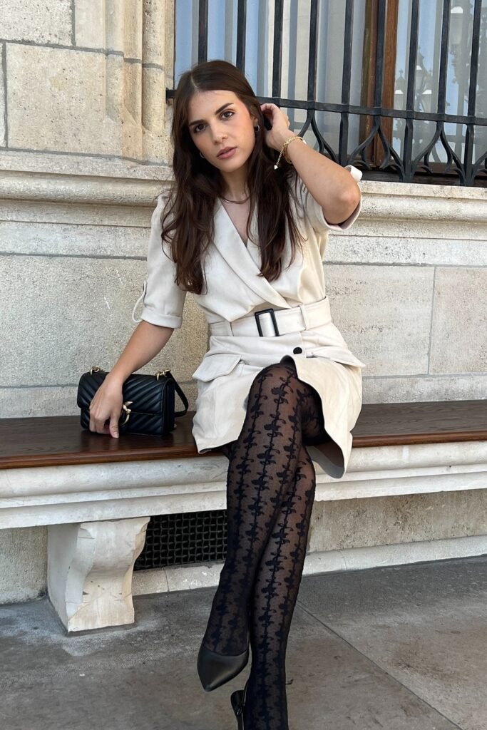 Beige Belted Shirt Dress + Patterned Black Tights + Black Heels + Black Quilted Bag
