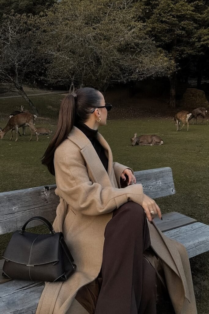 Beige Long Coat + Black Turtleneck + Brown Wide Pants + Black Handbag