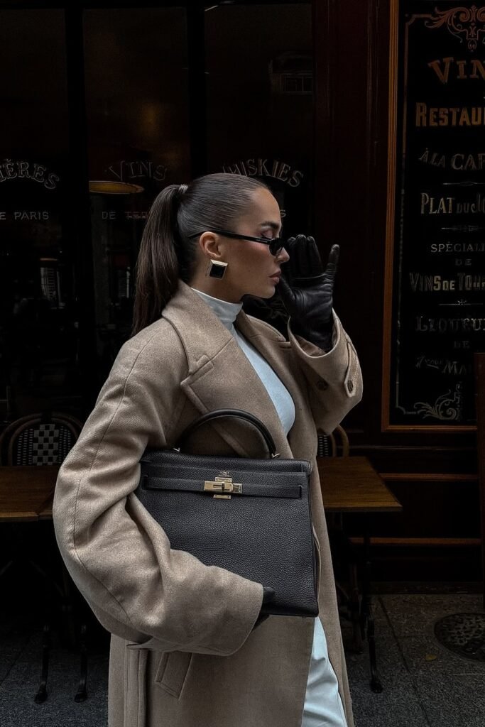 Beige Long Coat + White Turtleneck Dress + Black Leather Gloves + Black Kelly Bag