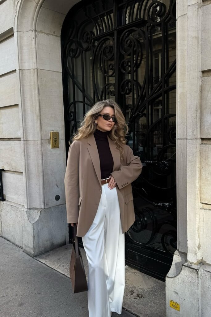 Beige Oversized Blazer + Dark Brown Turtleneck + White Wide-Leg Trousers + Brown Tote Bag