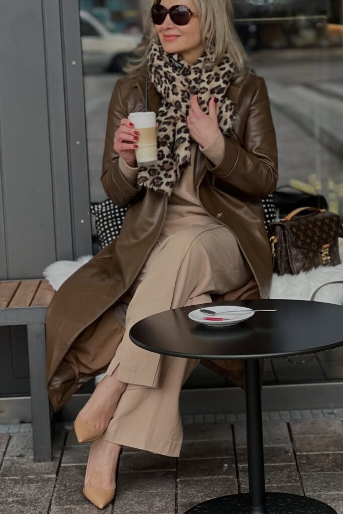Beige Sweater + Beige Wide-Leg Pants + Brown Leather Coat + Leopard Print Scarf + Beige Heels + Brown Monogram Handbag