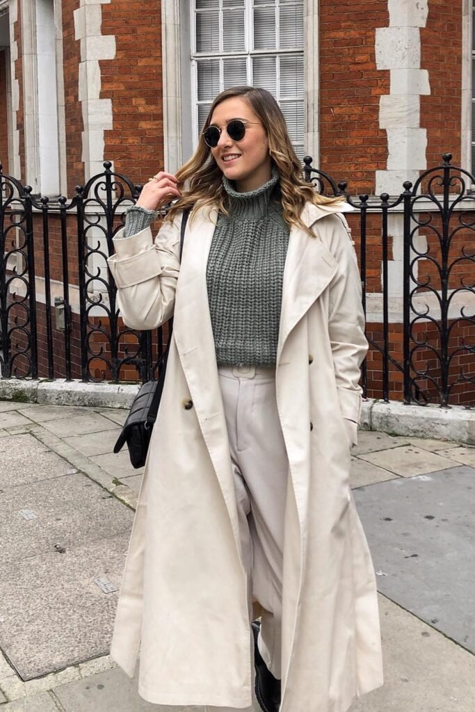 Beige Trench Coat + Sage Chunky Turtleneck + Cream Pleated Trousers + Black Crossbody Bag