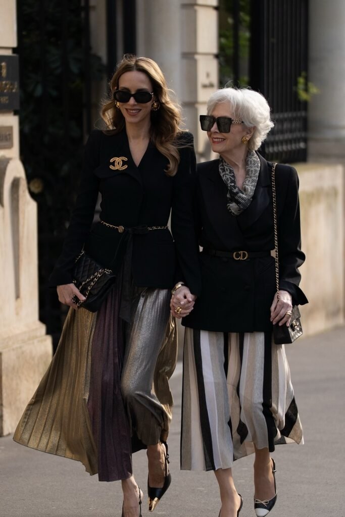 Black Fitted Blazer + Metallic Pleated Midi Skirt + Black Quilted Bag + Statement Brooch