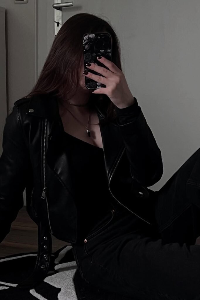 Black Leather Biker Jacket + Black Tank Top + Black High-Waisted Jeans + Minimal Pendant Necklace