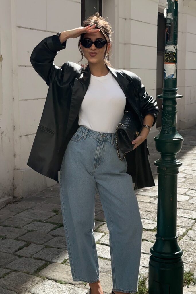 Black Leather Blazer + White T-Shirt + Blue High-Waisted Jeans + Black Bag
