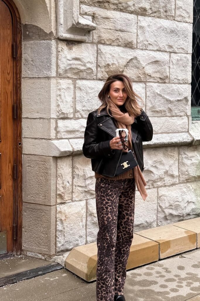 Black Leather Jacket + Brown Knit Sweater + Leopard Print Pants + Camel Scarf + Black Crossbody Bag