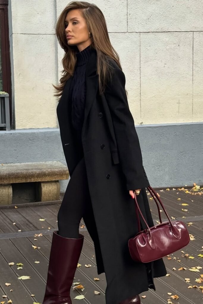 Black Long Wool Coat + Black Knit Turtleneck + Black Leggings + Burgundy Tall Boots + Burgundy Structured Bag