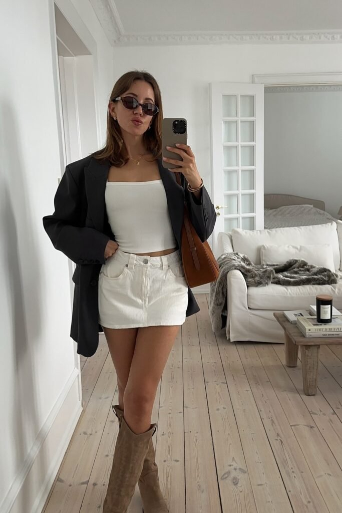Black Oversized Blazer + White Tube Top + White Mini Skirt + Beige Knee-High Boots