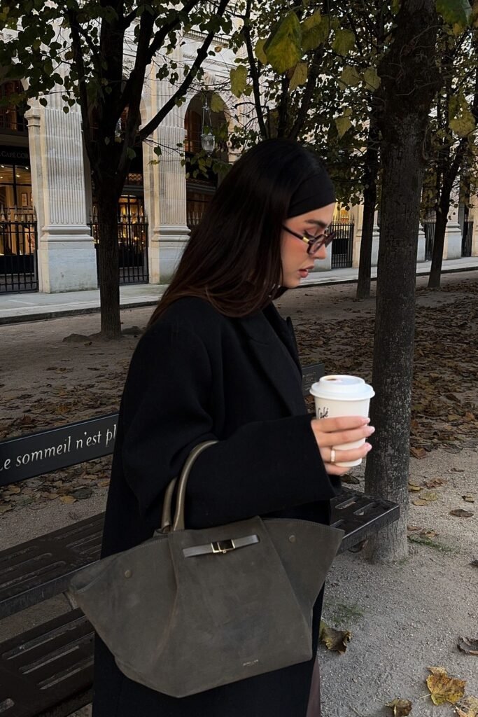 Black Oversized Coat + Black Headband + Black Dress + Grey Suede Tote Bag + Coffee Cup