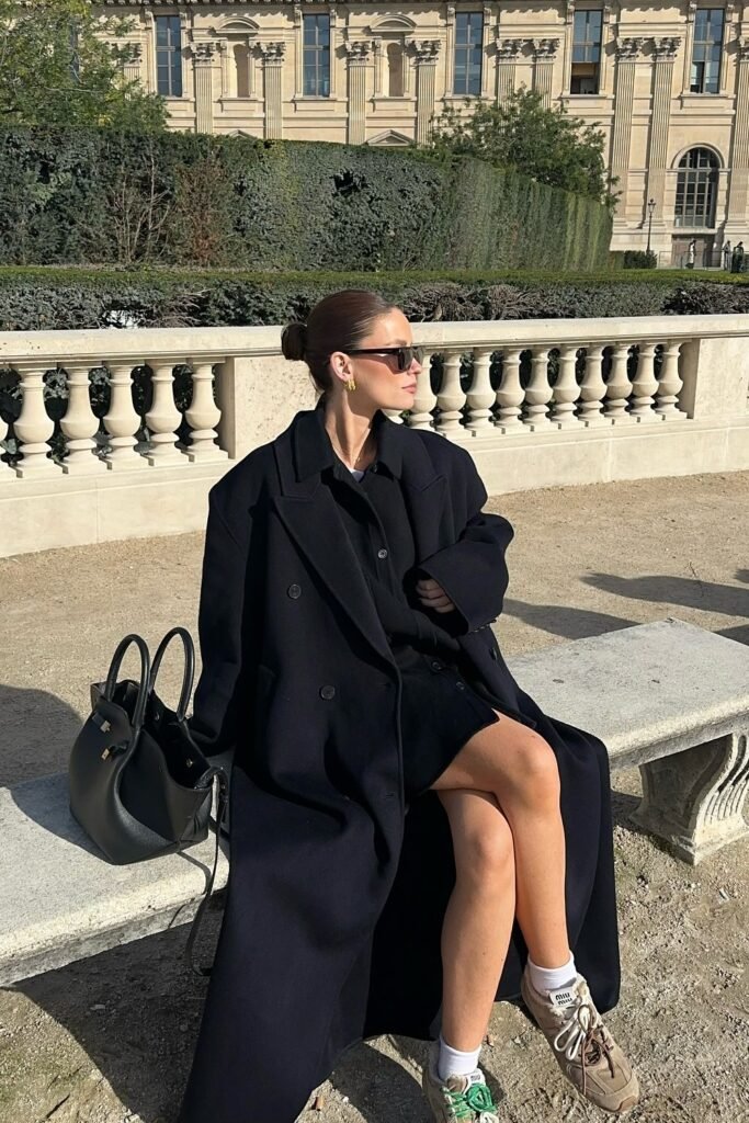 Black Oversized Coat + Black Mini Dress + White Socks + Beige Sneakers + Black Tote Bag