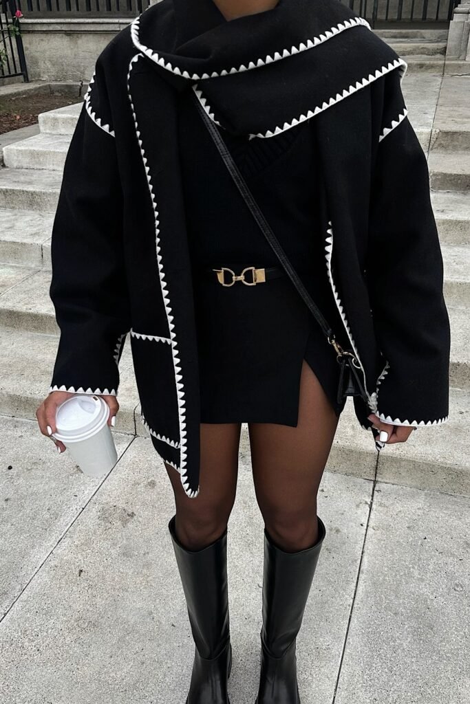 Black Oversized Jacket with White Trim + Black Mini Skirt + Sheer Tights + Black Boots