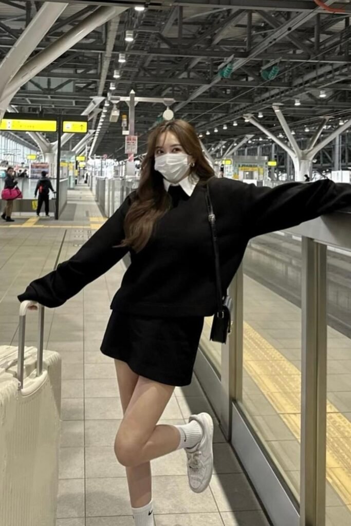 Black Oversized Sweater + White Collared Shirt + Black Mini Skirt + White Sneakers + Black Crossbody