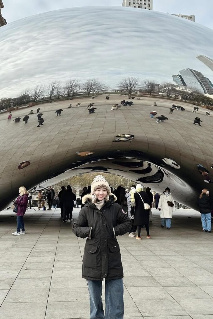 Black Parka with Fur Hood + Blue Wide-Leg Jeans + Beige Knit Beanie