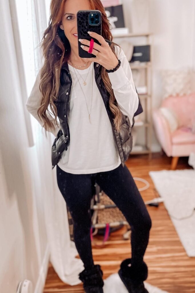 Black Puffer Vest + White Long-Sleeve Tee + Black Leggings + Black Fuzzy Boots