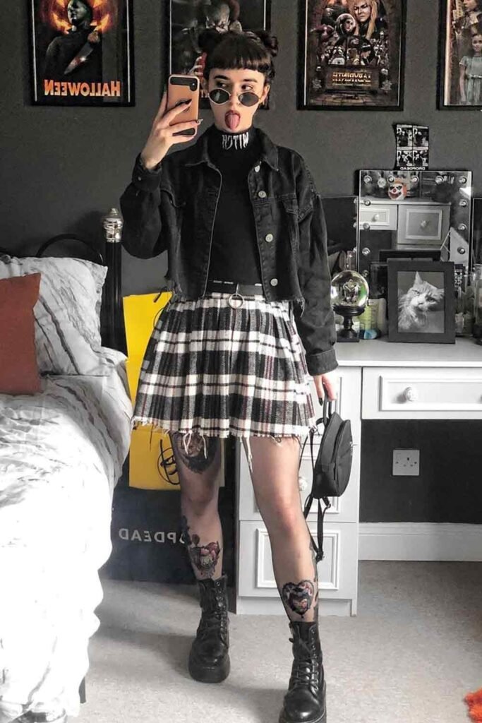 Black Turtleneck + Cropped Black Denim Jacket + Plaid Pleated Mini Skirt + Combat Boots + Mini Backpack