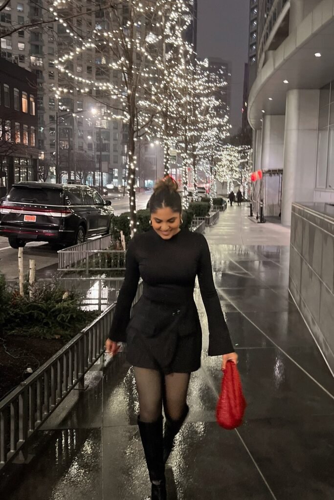 Black Turtleneck Dress + Sheer Black Tights + Black Knee-High Boots + Red Woven Clutch