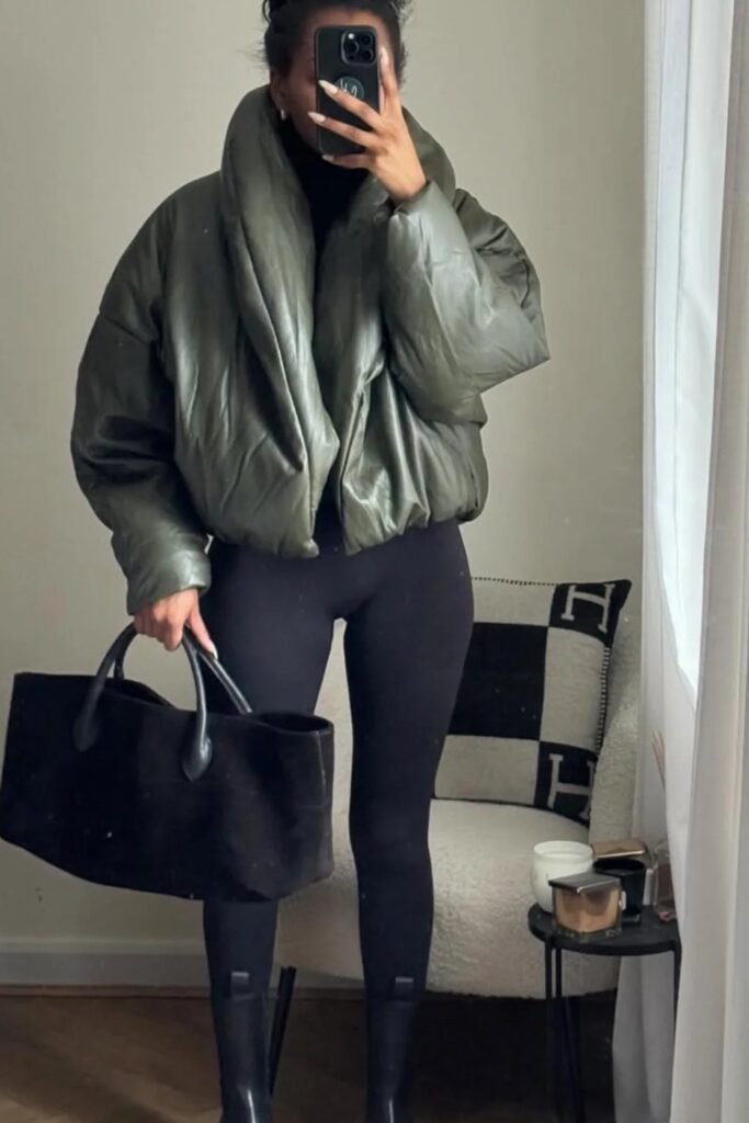 Black Turtleneck Top + Oversized Green Puffer Jacket + Black Leggings + Black Tote Bag + Black Boots