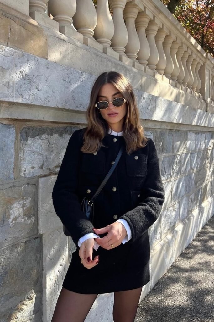 Black Tweed Mini Dress with Gold Buttons + White Shirt Layered Underneath + Black Crossbody Bag + Sheer Tights