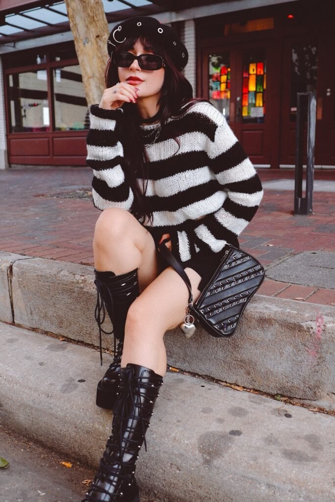 Black & White Striped Oversized Sweater + Black Mini Skirt + Studded Knee-High Platform Boots + Safety-Pin Beret + Black Quilted Shoulder Bag