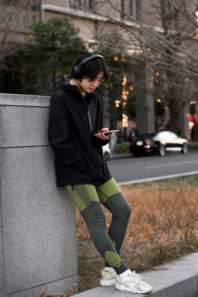 Black Zip Hoodie + Green Patterned Leggings + White Sneakers