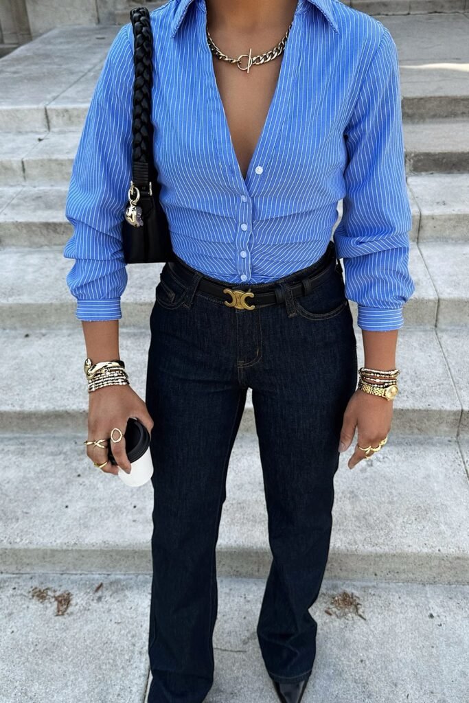 Blue Striped Button-Up Shirt + Dark Wash Jeans + Black Belt + Black Shoulder Bag