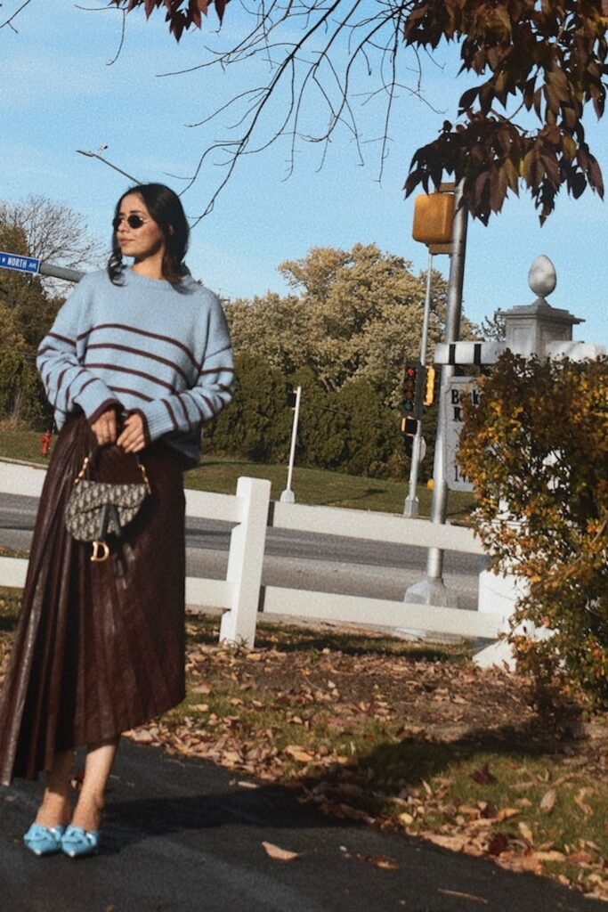 Blue Striped Knit Sweater + Brown Pleated Leather Skirt + Blue Bow Heels + Dior Saddle Bag