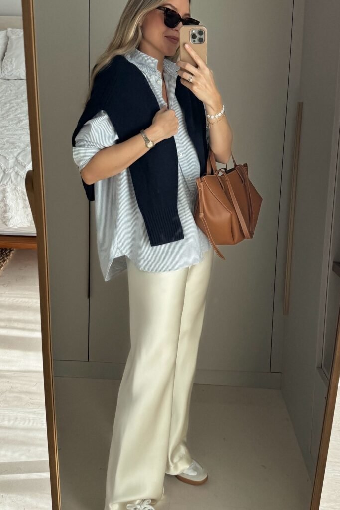 Blue Striped Oversized Shirt + Cream Wide-Leg Pants + White Sneakers + Brown Tote Bag