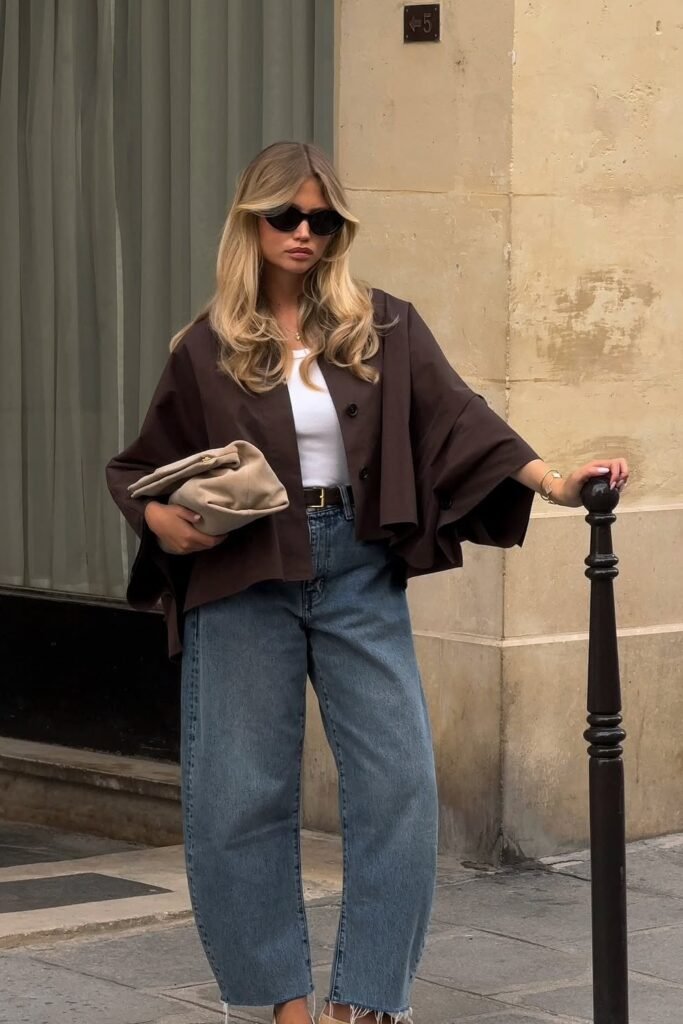 Brown Cropped Jacket + White Tank Top + High-Waist Jeans + Beige Clutch