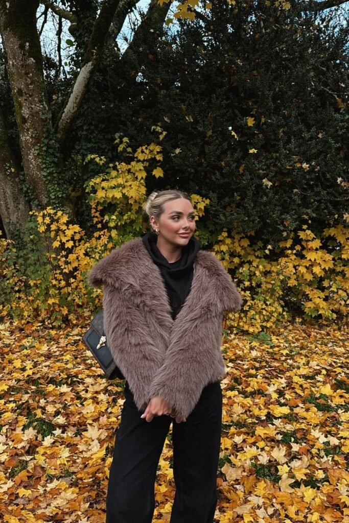 Brown Faux-Fur Jacket + Black Hoodie + Black Pants + Black Structured Bag