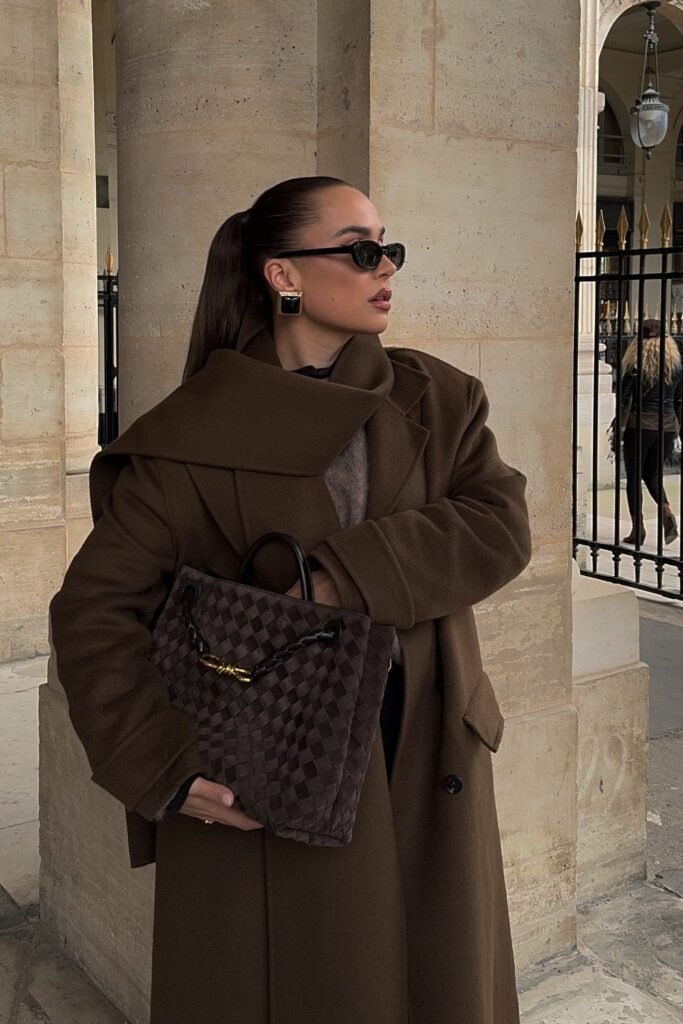 Brown Overcoat + Beige Sweater + Black Pants + Black Sunglasses + Black Handbag