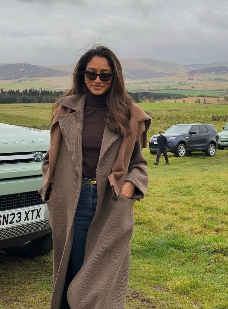 Brown Oversized Coat + Dark Brown Turtleneck + Blue Jeans + Black Sunglasses