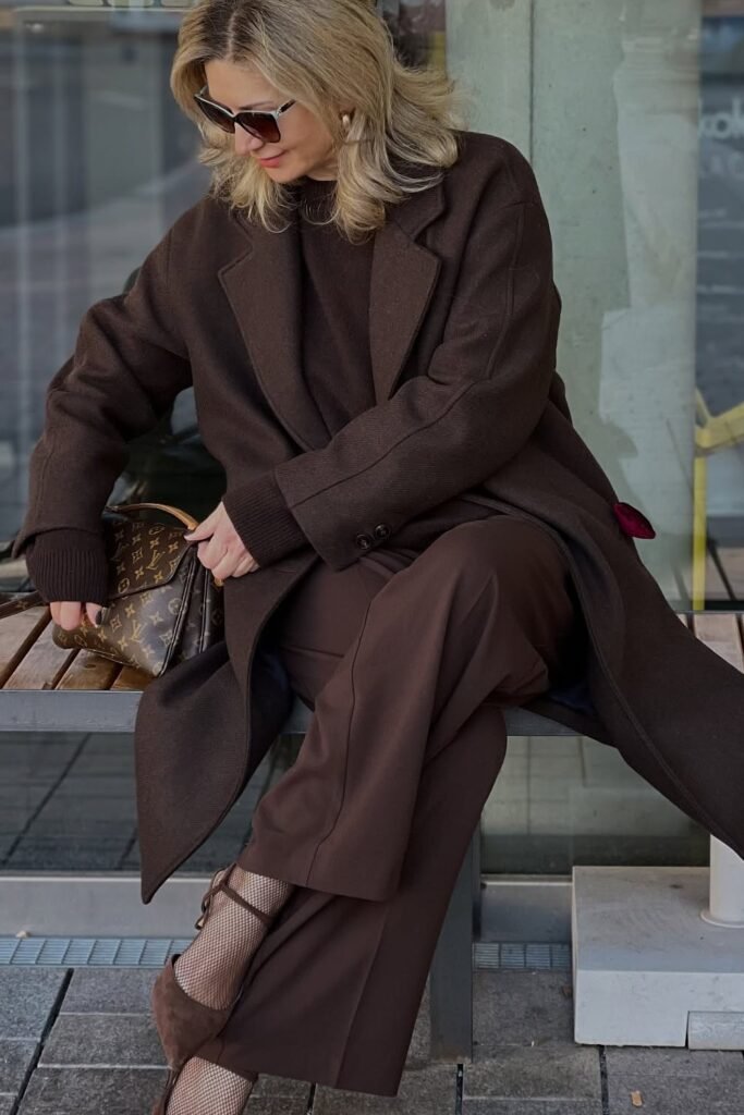 Brown Sweater + Long Brown Coat + Brown Wide-Leg Pants + Brown Heels + Brown Monogram Handbag