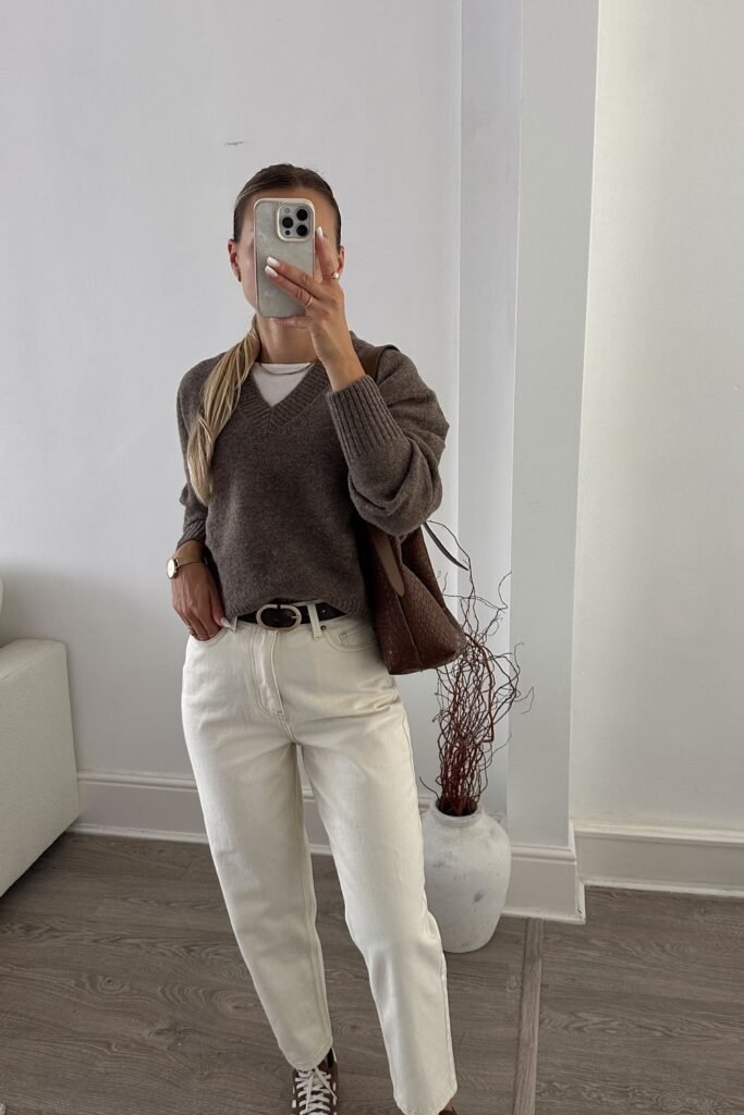 Brown V-Neck Sweater + White T-Shirt Layer + White Straight Jeans + Brown Sneakers + Brown Tote Bag