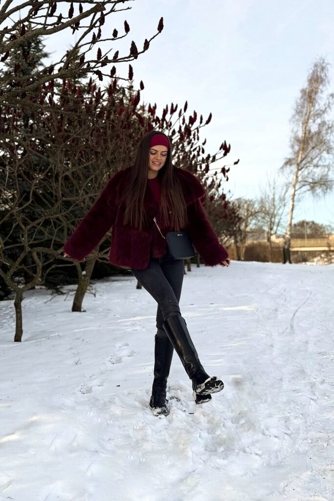 Burgundy Faux Fur Coat + Burgundy Top + Grey Skinny Jeans + Black Tall Boots + Burgundy Headband