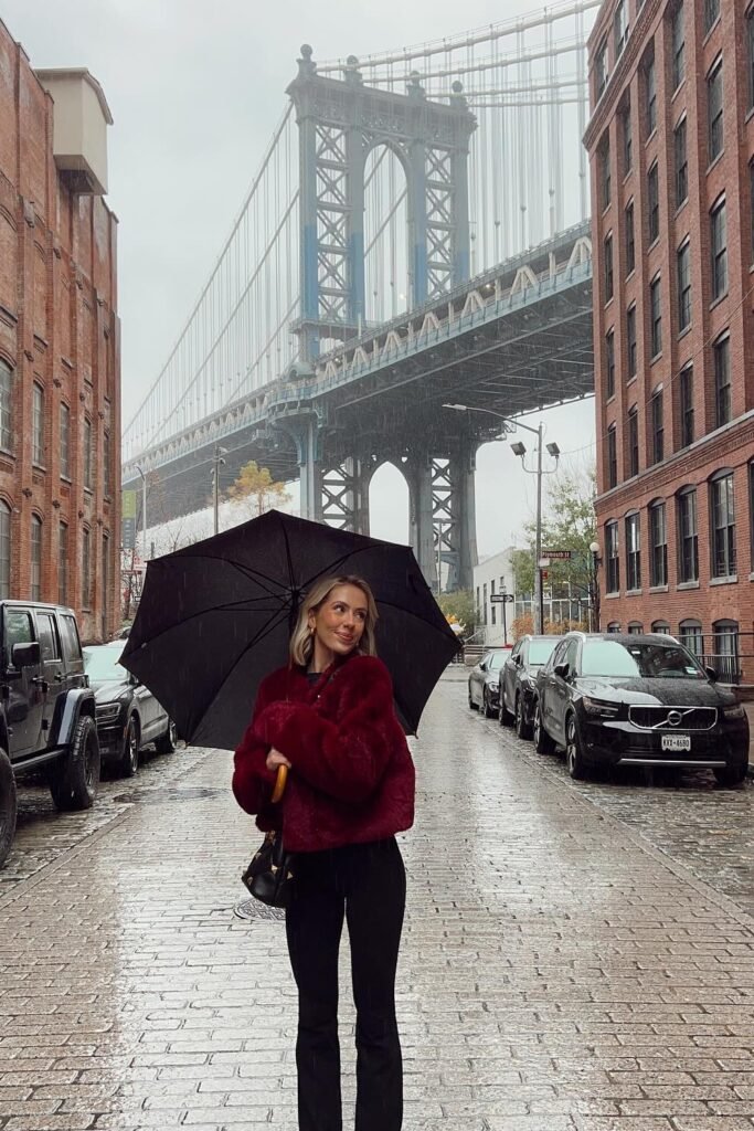 Burgundy Faux Fur Jacket + Black Flared Jeans + Black Handbag