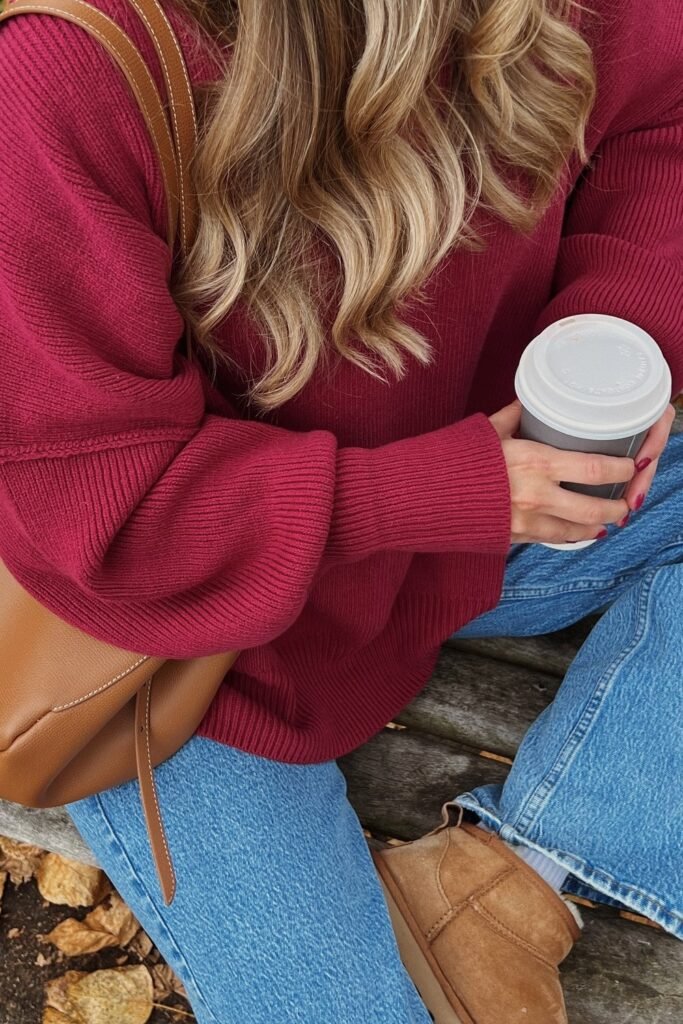 Burgundy Oversized Sweater + Light Wash Straight-Leg Jeans + Chestnut UGG Boots + Camel Shoulder Bag