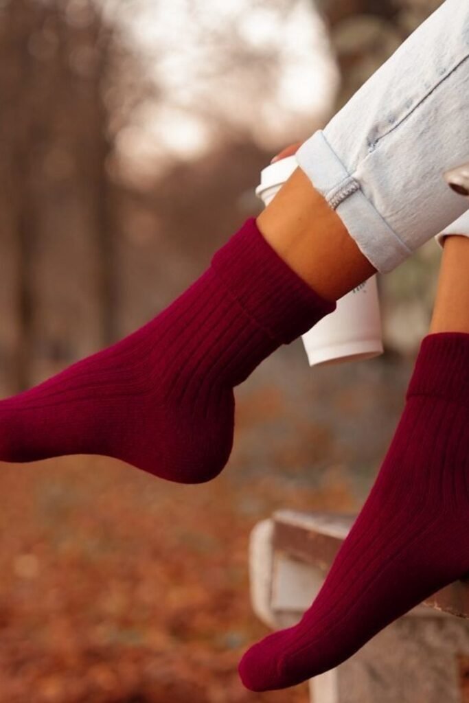 Burgundy Ribbed Knit Socks + Light Blue Rolled-Up Jeans + White Coffee Cup