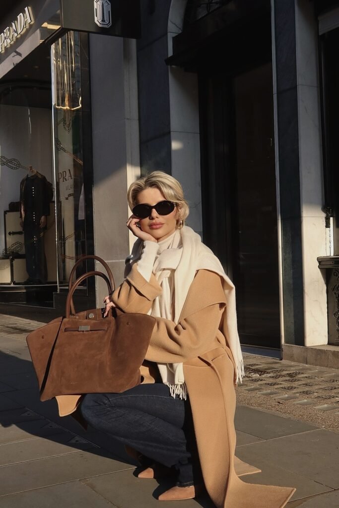 Camel Coat + White Scarf + Brown Handbag + Dark Denim Jeans