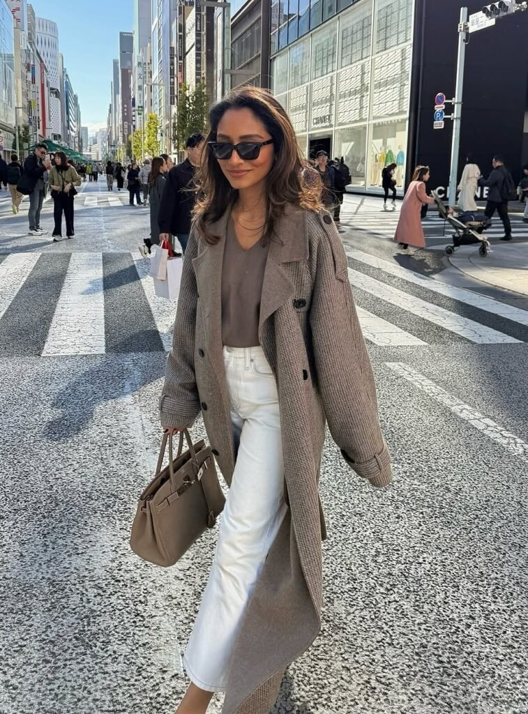 Checked Long Coat + Taupe V-Neck Knit + White Cropped Jeans + Taupe Structured Handbag + Black Sunglasses