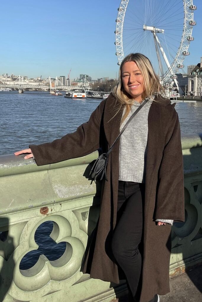Chocolate Long Overcoat + Cropped Grey Sweater + Black Straight Jeans + Crossbody Bag