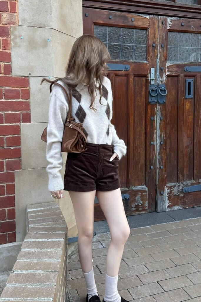 Cream Argyle Sweater + Dark Brown Corduroy Shorts + Brown Shoulder Bag + White Socks + Black Loafers
