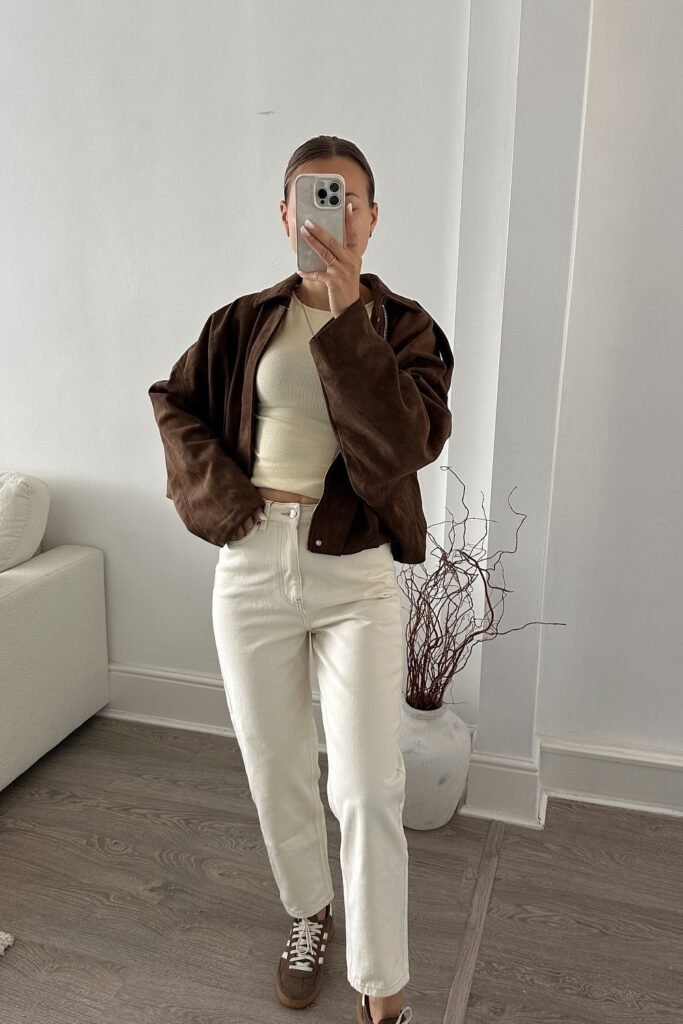 Cream Crop Top + Brown Suede Jacket + White Straight Jeans + Brown Sneakers