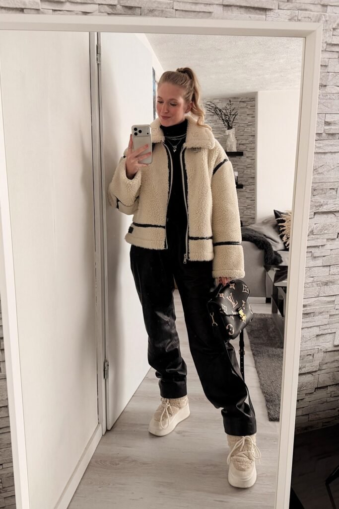 Cream Shearling Aviator Jacket + Black Turtleneck + Black Leather Trousers + Cream Platform Shearling Boots