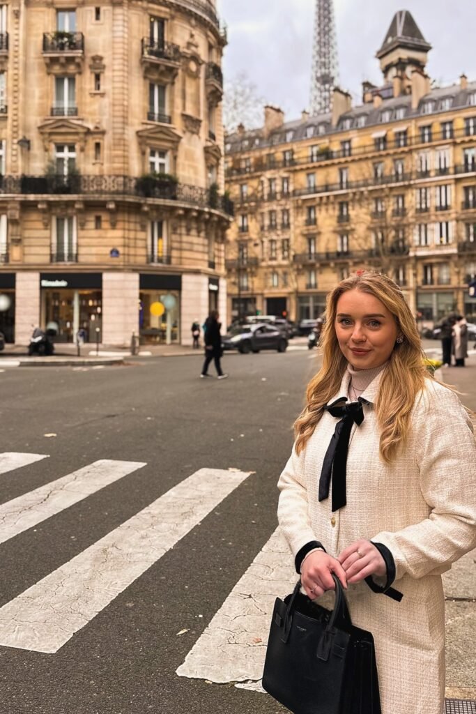 Cream Textured Coat with Black Bow-Tie Detail + White Shirt + Black Structured Handbag