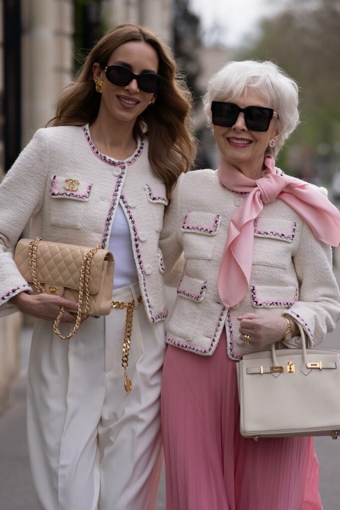 Cream Tweed Jacket with Pink Trim + White Trousers + Beige Quilted Bag (paired with Cream Tweed Jacket + Pink Pleated Maxi Skirt + White Structured Bag + Pink Neck Scarf)