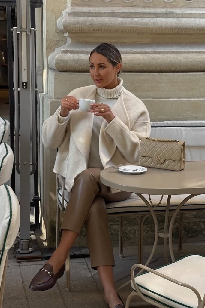 Cream Wool Coat + Cream Turtleneck Sweater + Brown Cropped Leather Pants + Beige Chanel Flap Bag + Brown Loafers