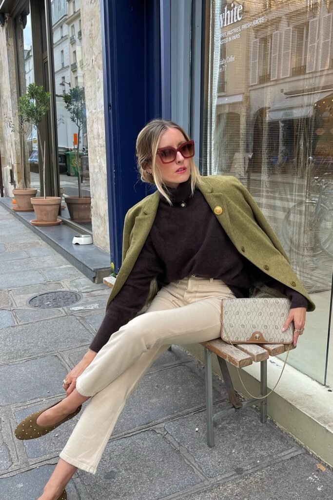 Dark Brown Turtleneck + Olive Green Blazer + Cream Trousers + Olive Flats + Patterned Beige Clutch + Sunglasses