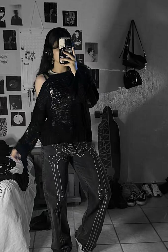 Distressed Black Knit Sweater + Black Wide-Leg Jeans with Skeleton Print + Black Sneakers