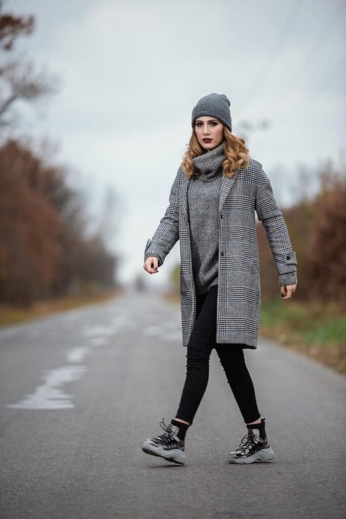 Grey Beanie + Grey Turtleneck Sweater + Plaid Long Coat + Black Skinny Pants + Chunky Sneakers
