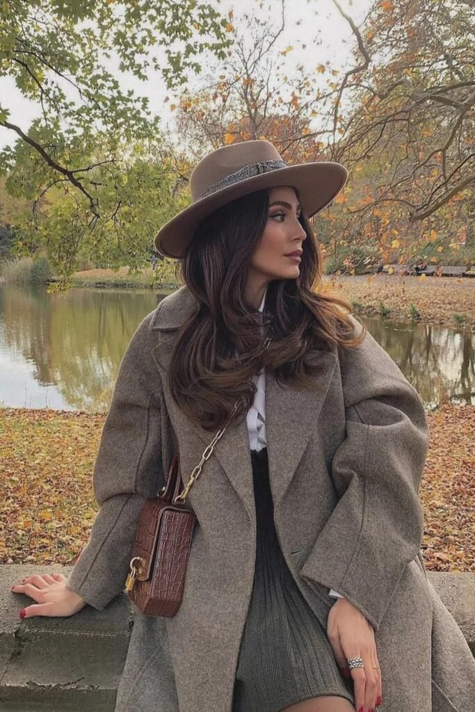 Grey Oversized Coat + White Blouse + Plaid Mini Skirt + Brown Crossbody Bag + Beige Fedora Hat
